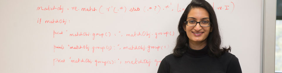 Woman in front of white board