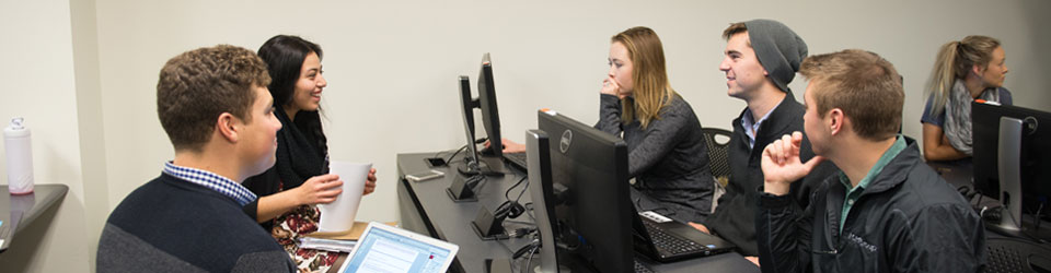 students working on computers in a group